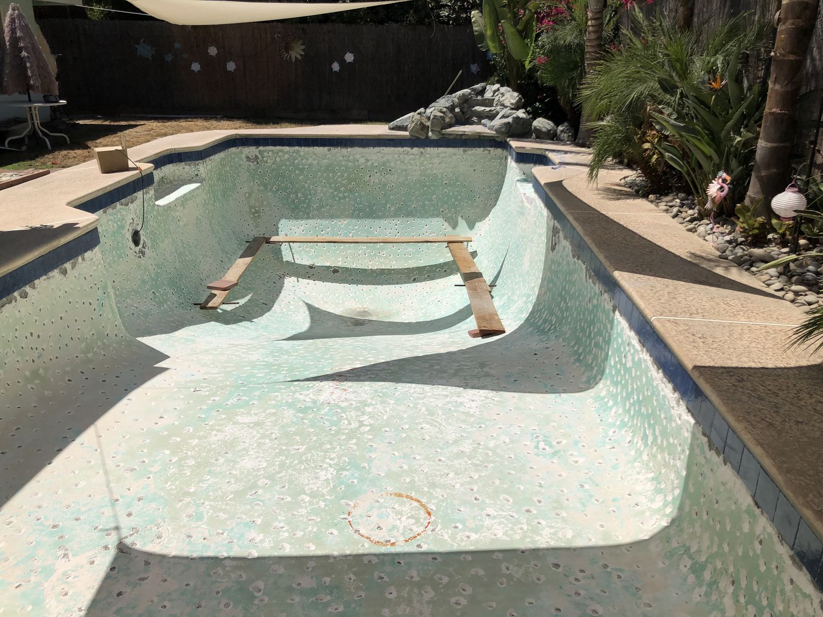 Before: drained pool during resurfacing