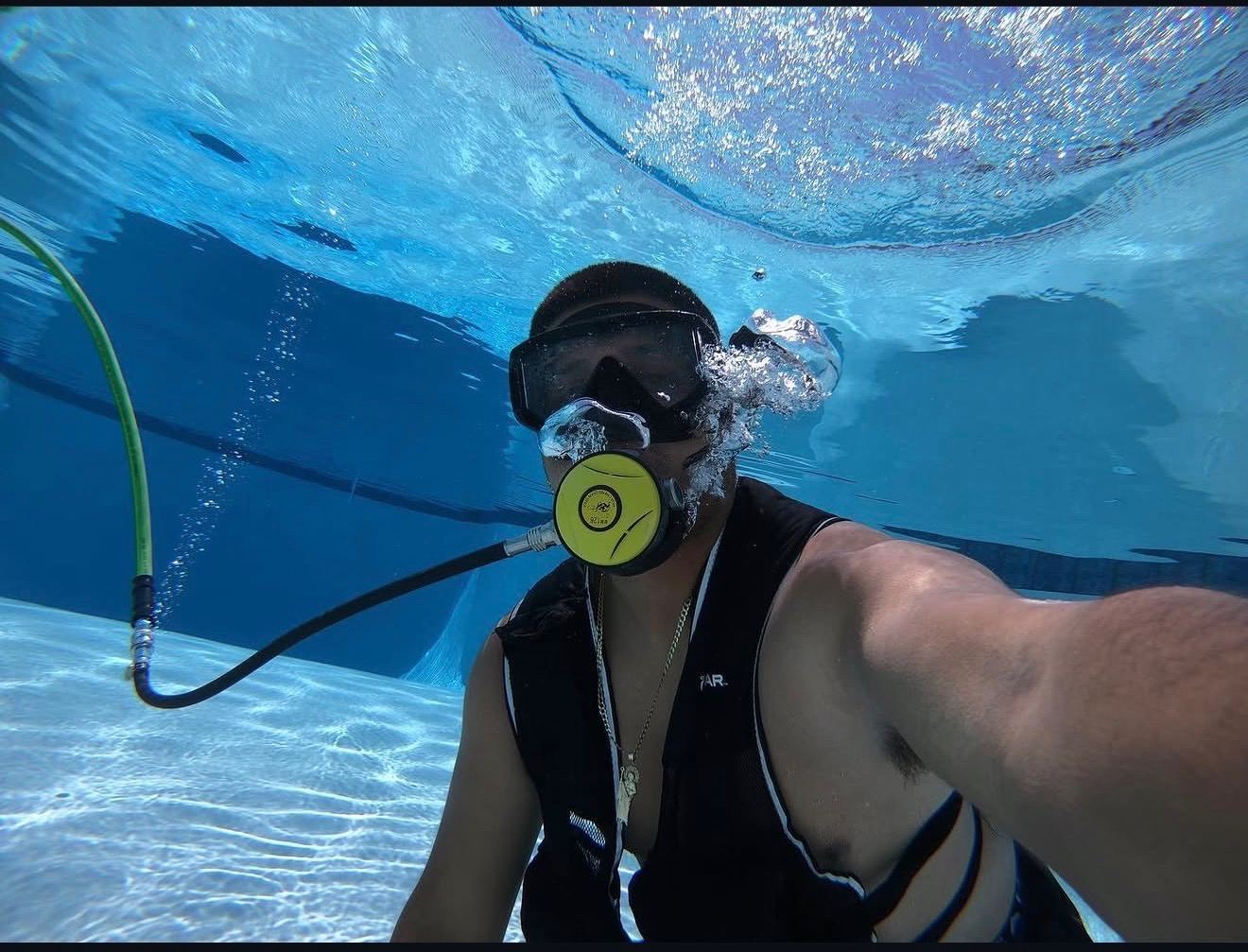 Diving into a crystal clear serviced pool