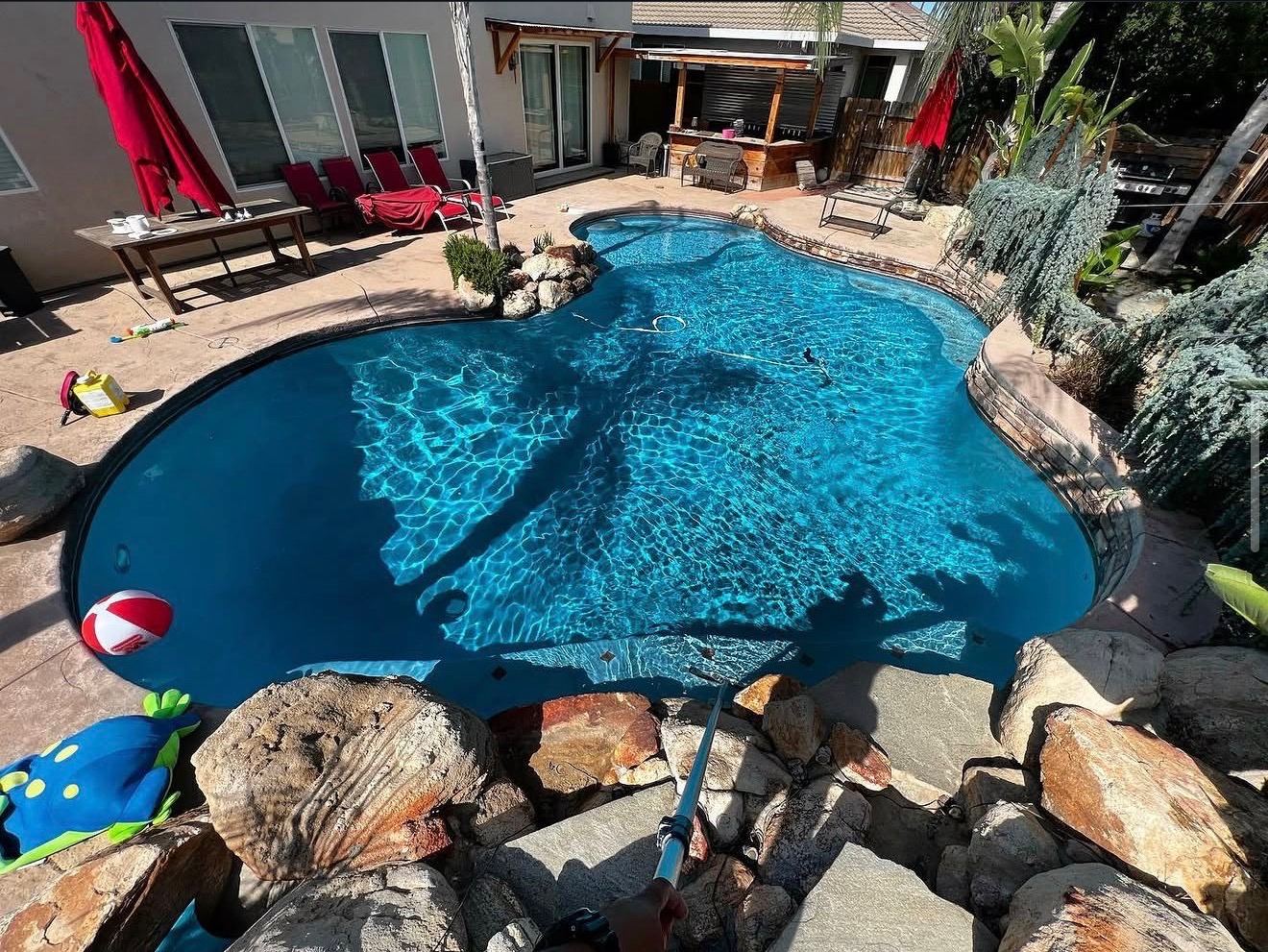 Freeform pool with waterfall feature
